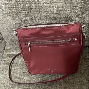 Michael Kors, Crossbody bag NWT the color is Merlot